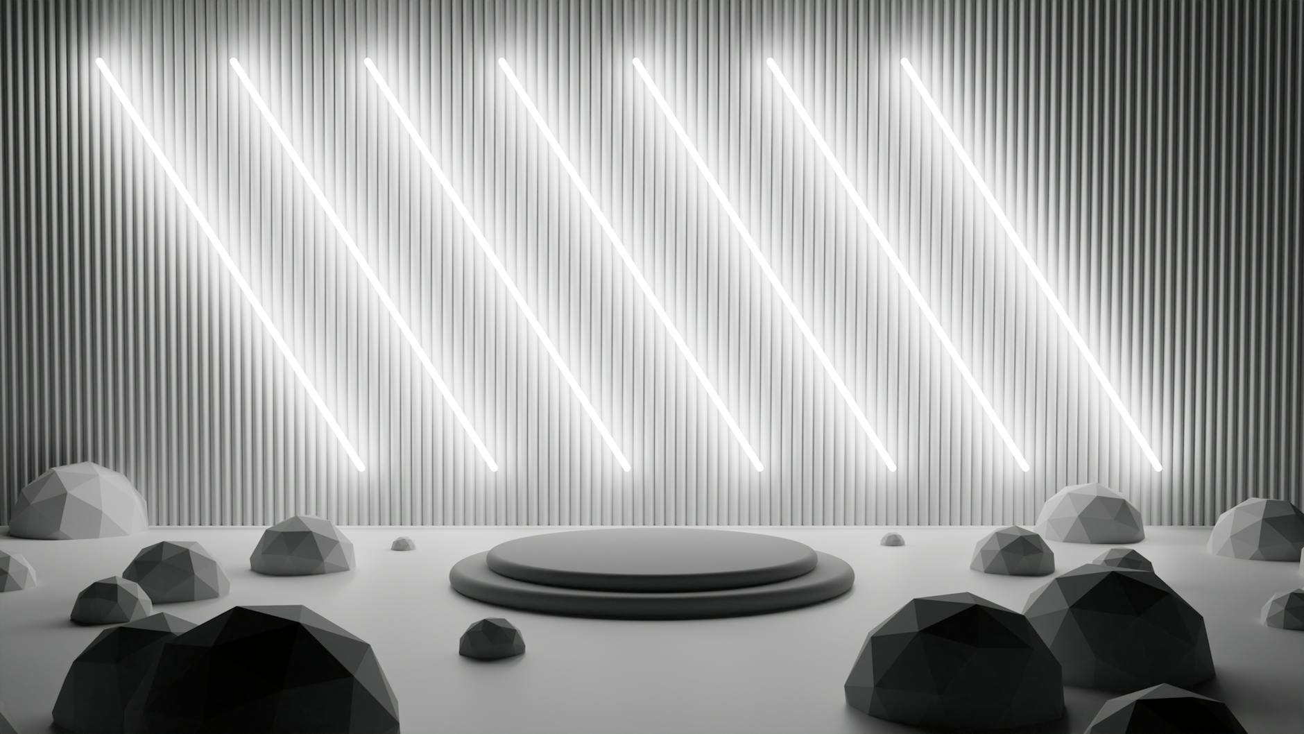 Modern geometric stage with neon lights and metallic shapes in a minimalist setting.