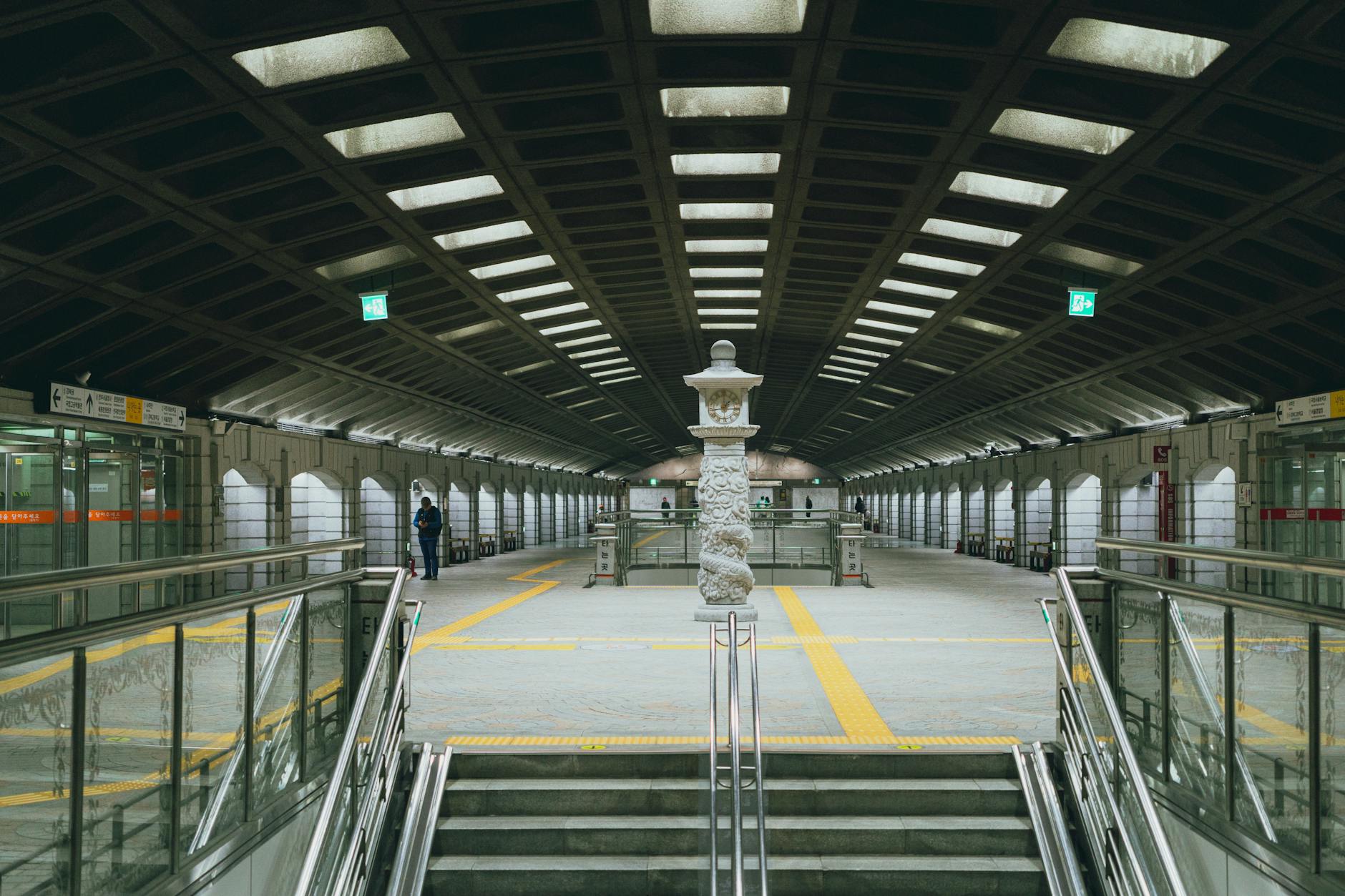 Symmetrical view of Gyeongbokgung Station with modern design in Seoul's subway system.