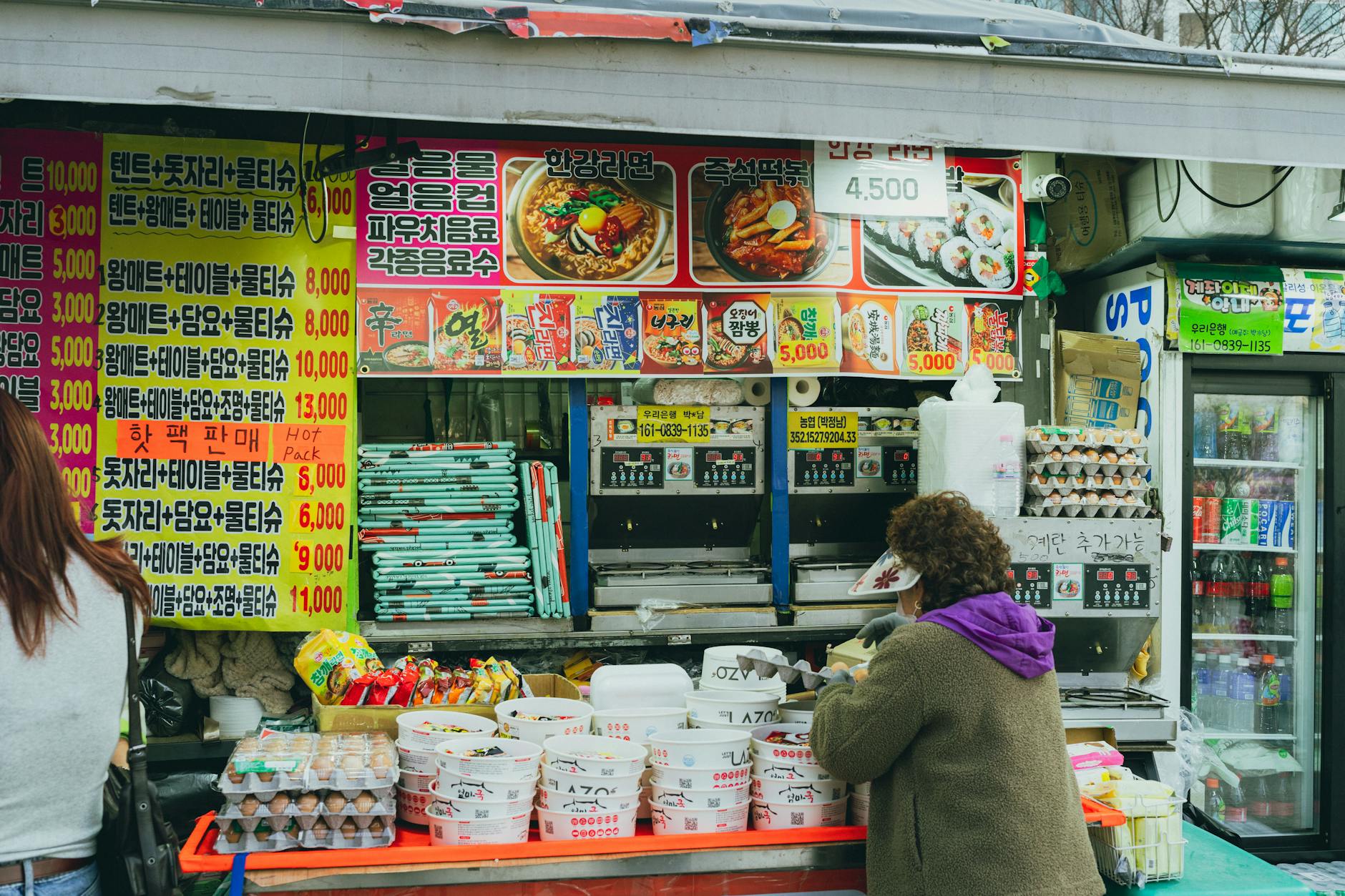 A vibrant Korean street food stall in Seoul, showcasing local culture and cuisine.